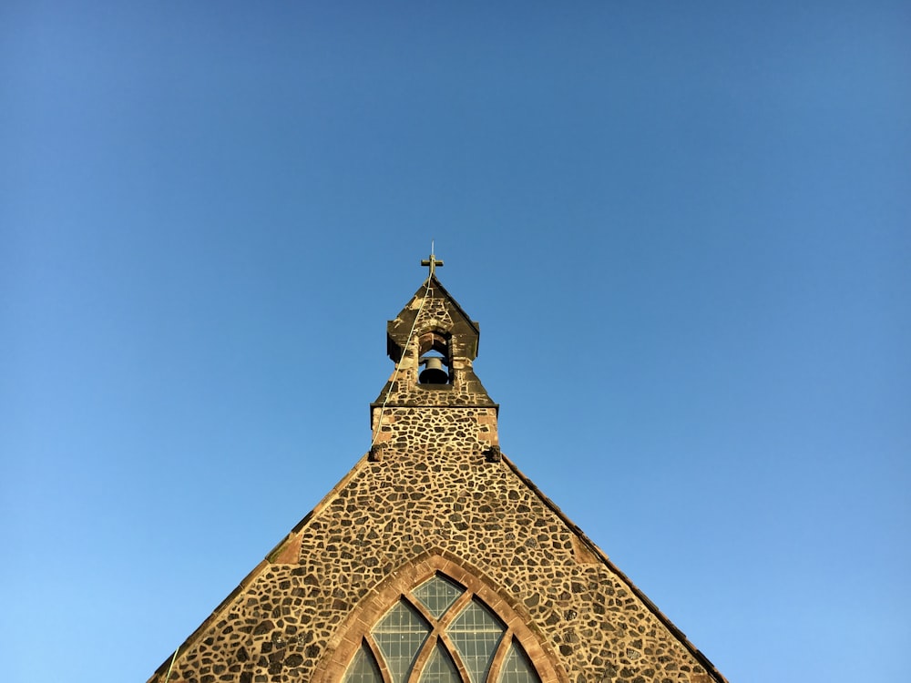 brown concrete building under blue sky during daytime