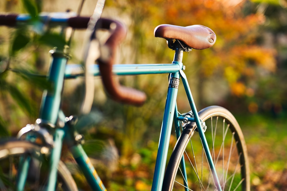 blue and black bicycle in tilt shift lens