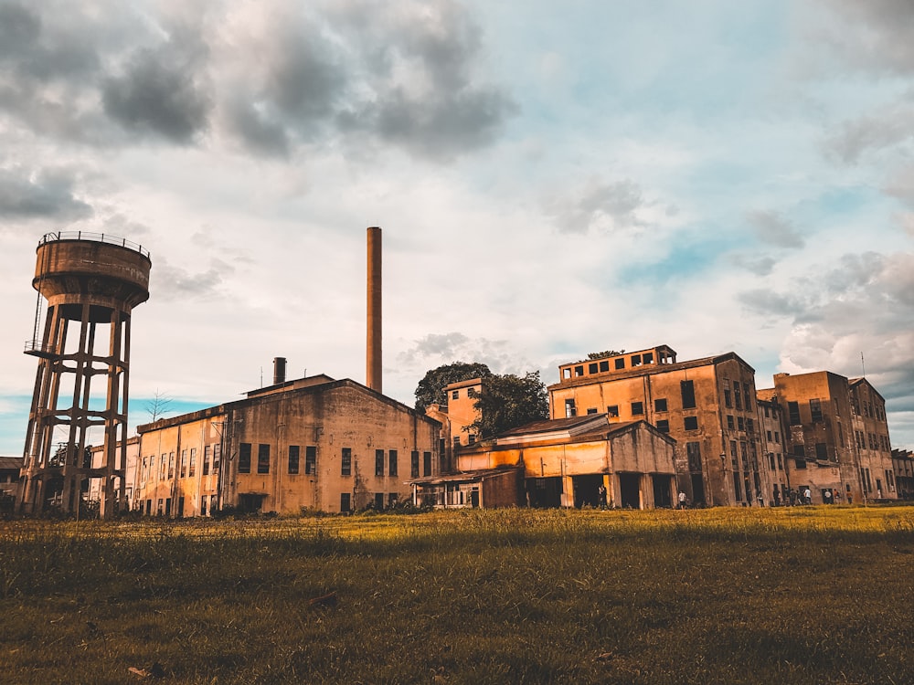 brown concrete building under cloudy sky during daytime