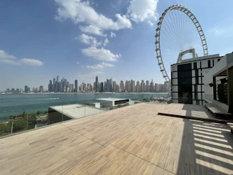 Spacious penthouse terrace overlooking the city skyline on a clear day.