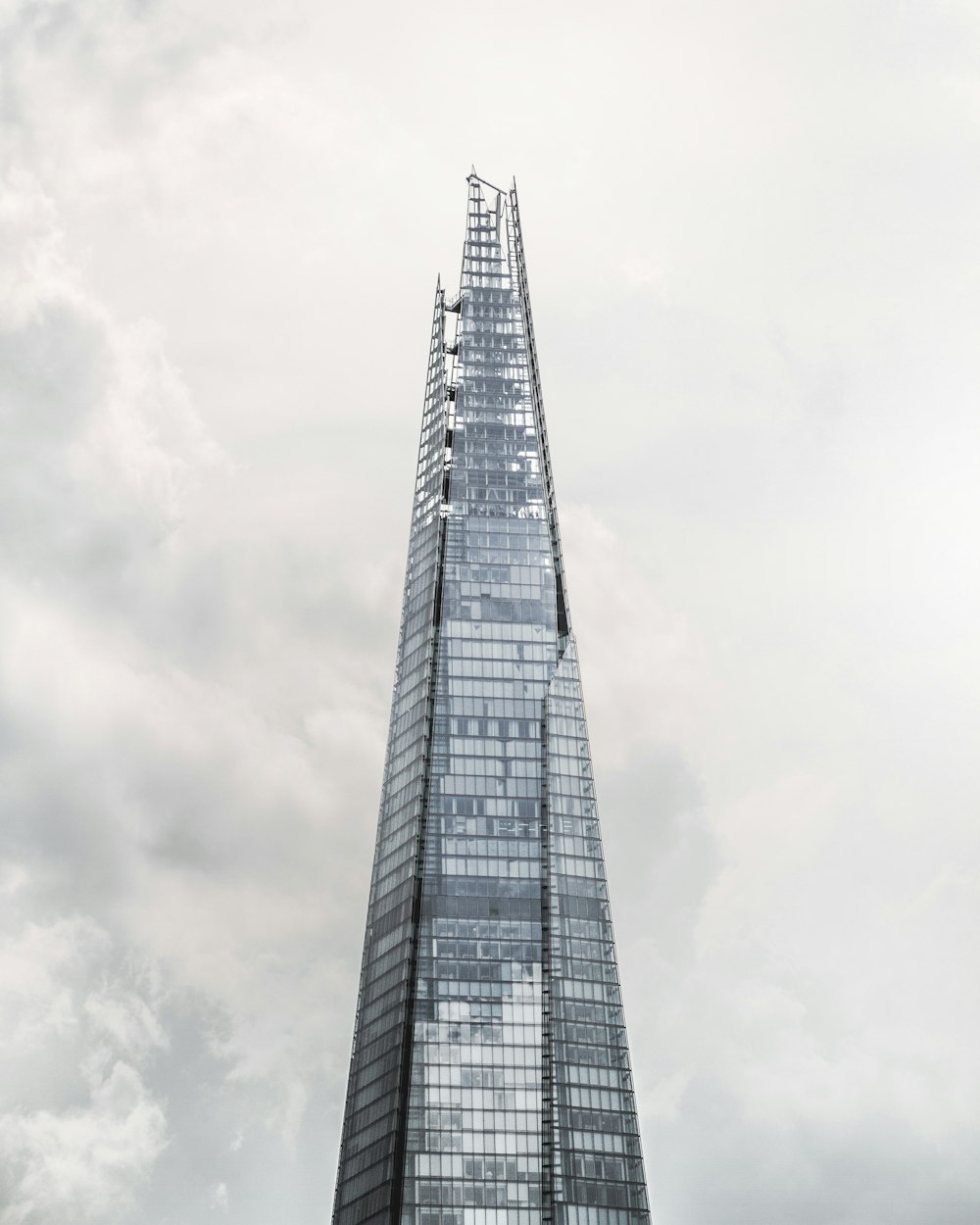 gray concrete building under white clouds during daytime