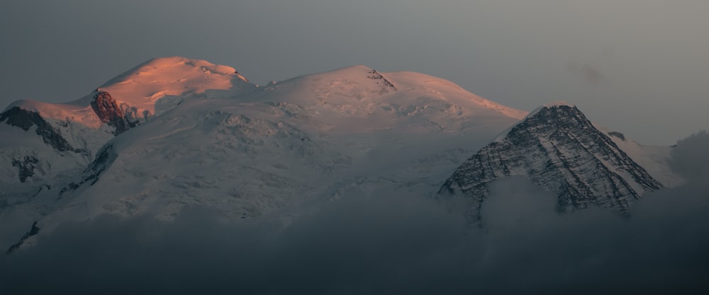 brown mountain under gray sky