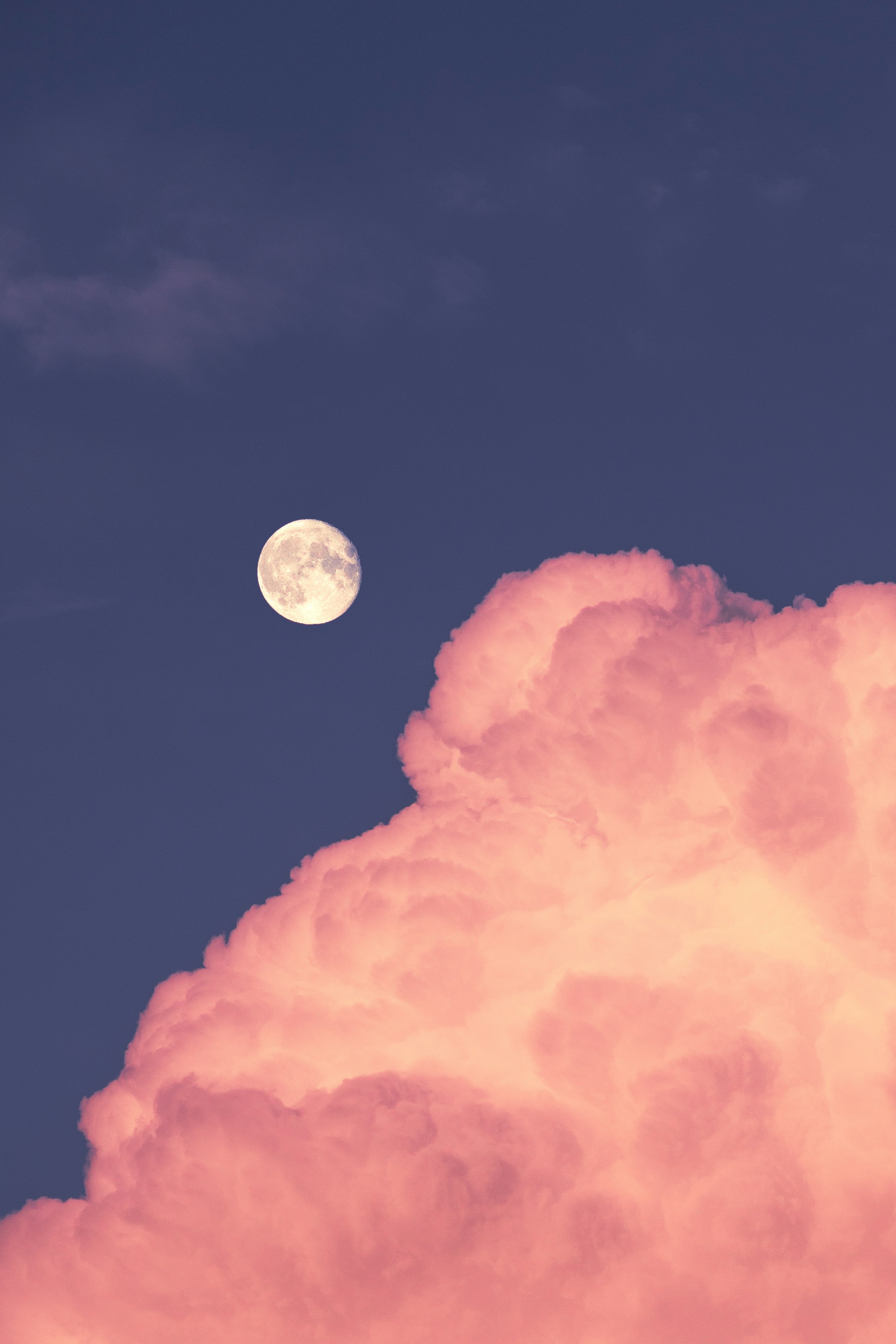 full moon over orange clouds