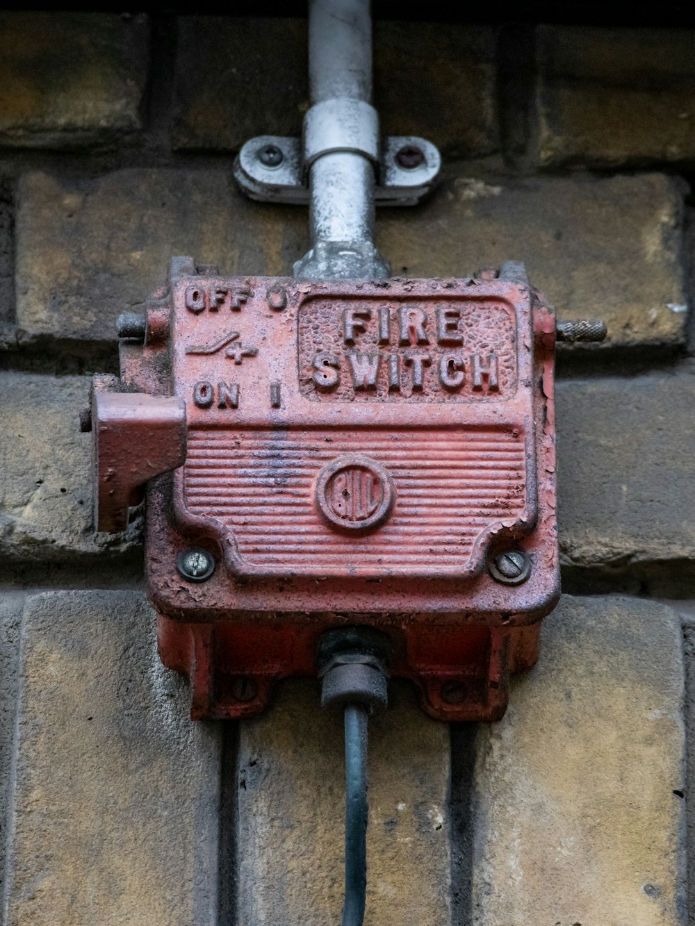 red and silver steel fire extinguisher