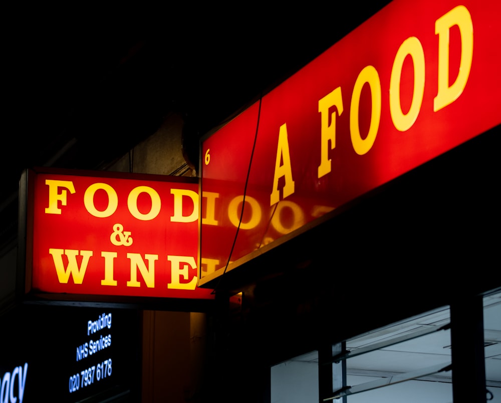 red and white open neon signage