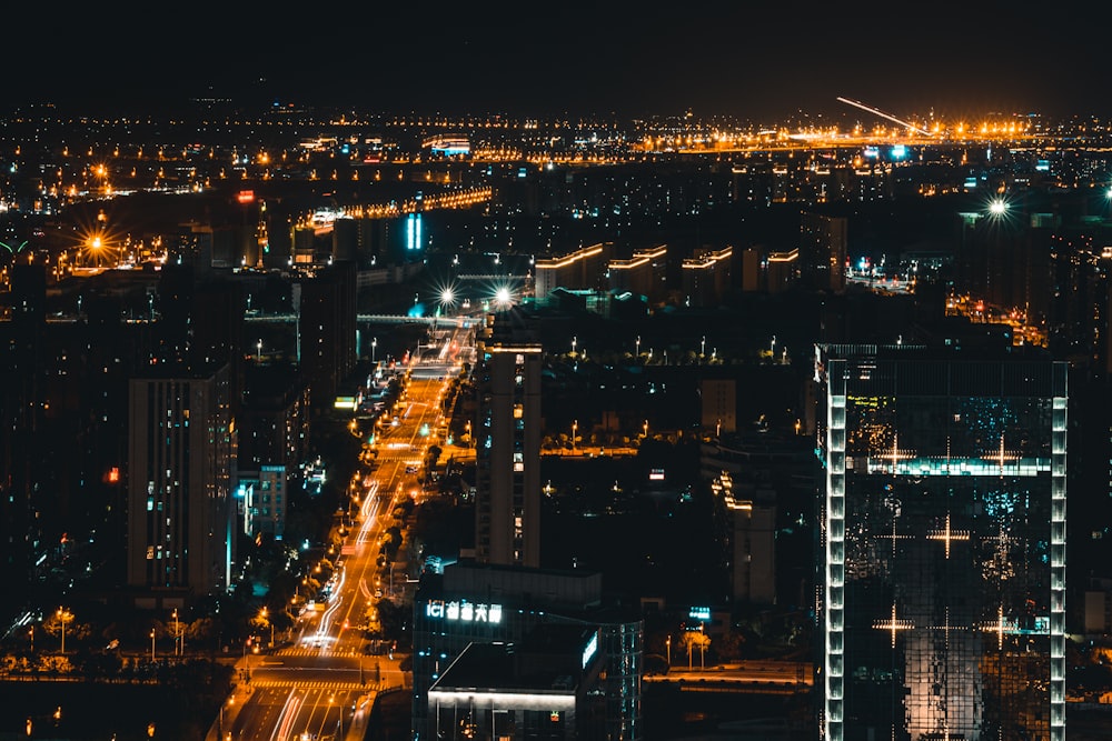 city with high rise buildings during night time