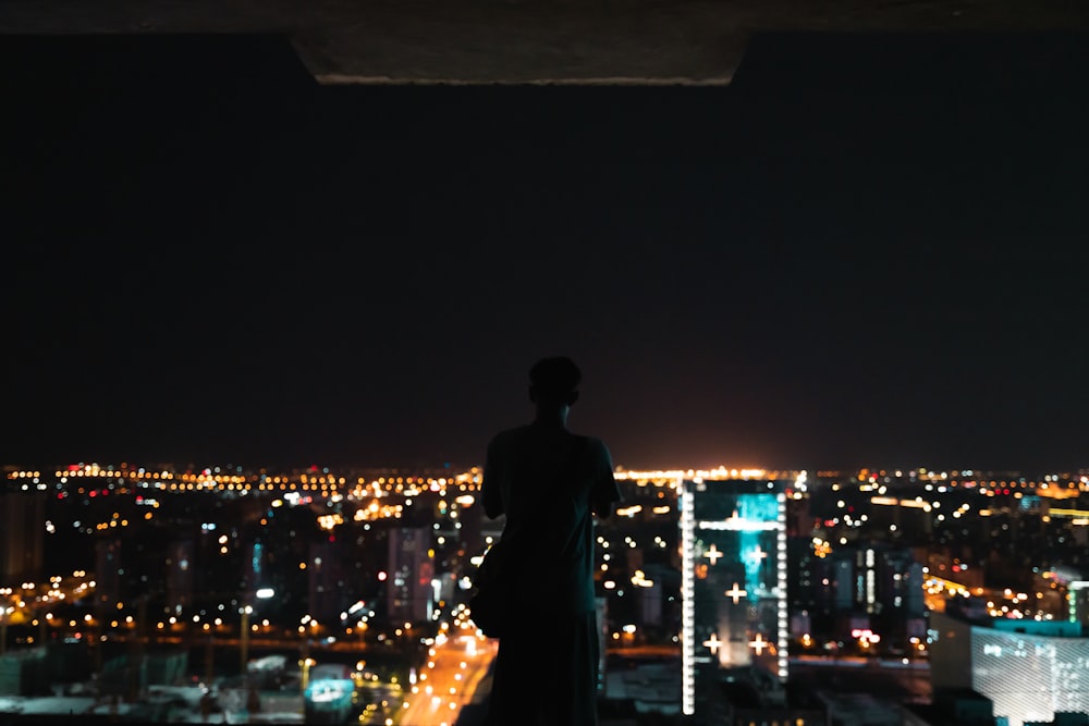 man and woman kissing during night time