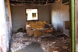 brown wooden bed frame beside white wall