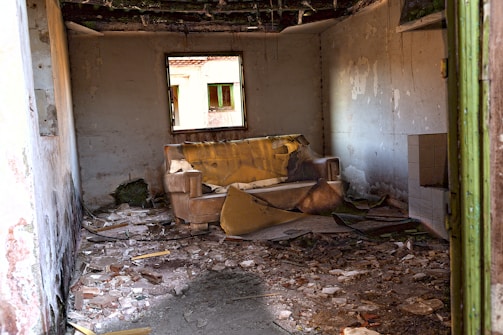 brown wooden bed frame beside white wall