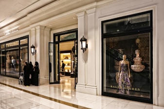 A personal shopper consulting with a client in a luxurious boutique.