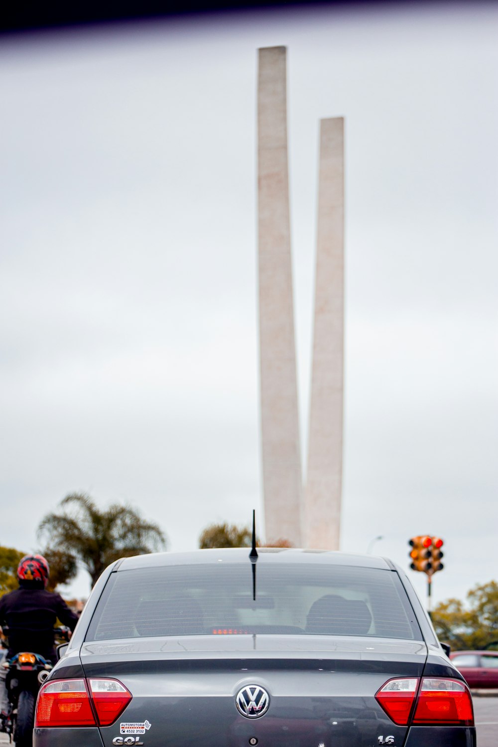 a car that is parked in front of a monument