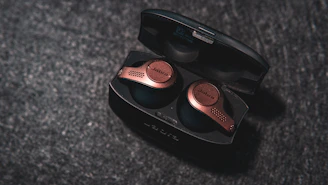 Modern wireless earbuds with elegant gold details