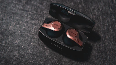 Modern wireless earbuds with elegant gold details