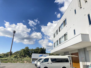 Aerial view of the Wright Legacy Group Limited headquarters with blue and white branded trucks parked outside.