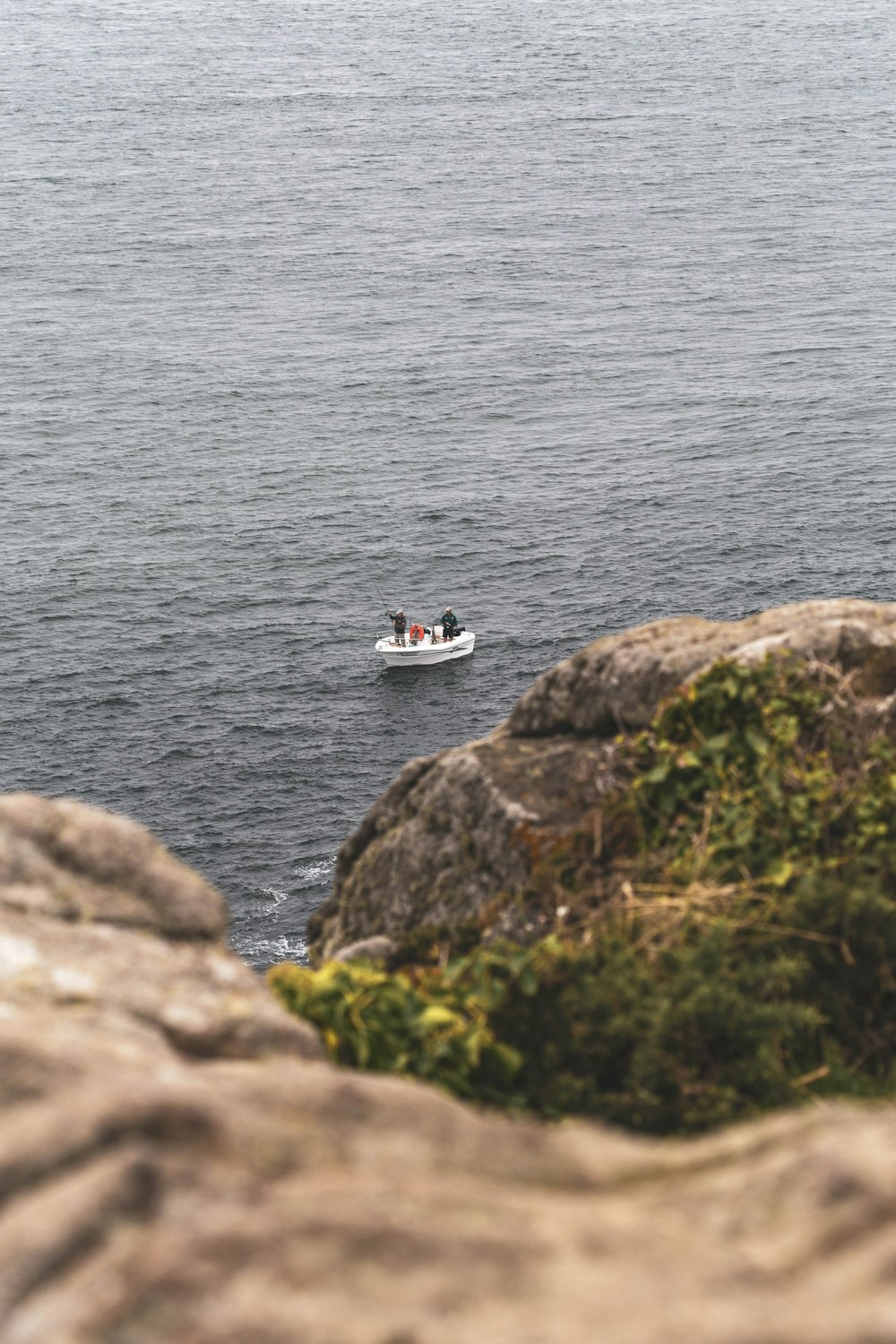 white and black boat on sea during daytime