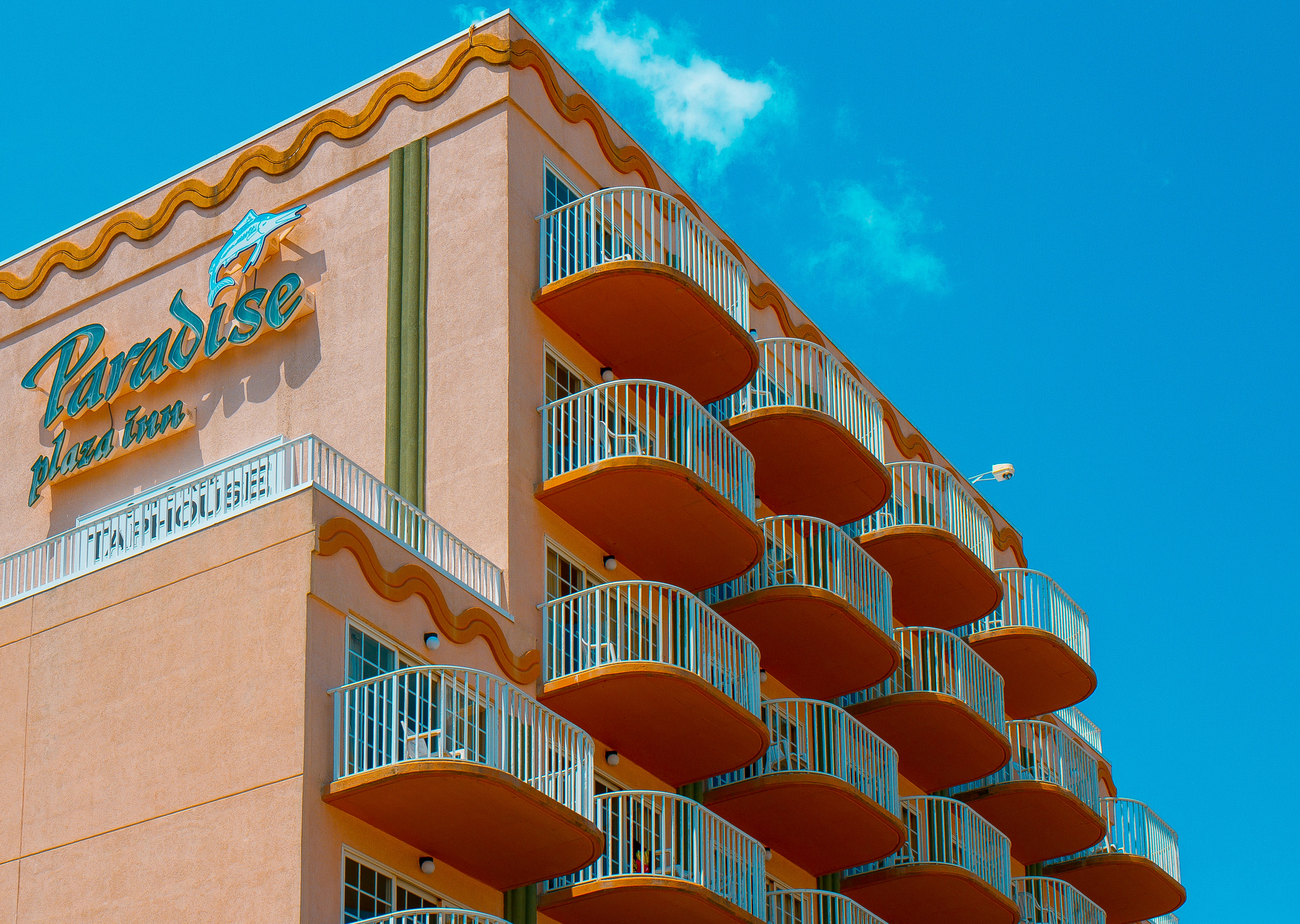 brown and white concrete building under blue sky during daytime