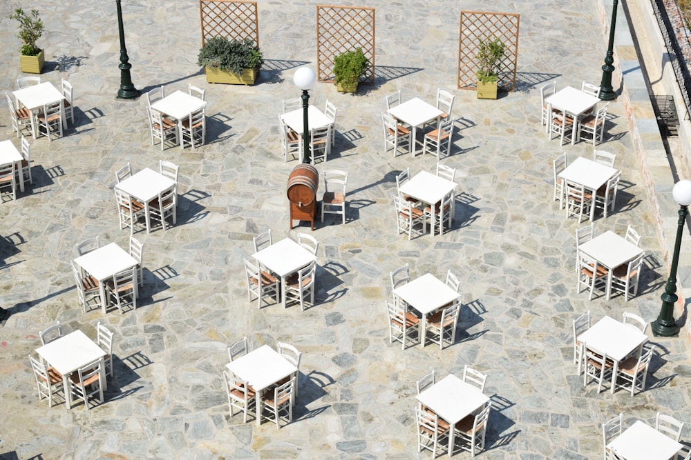 white and brown wooden chairs and tables
