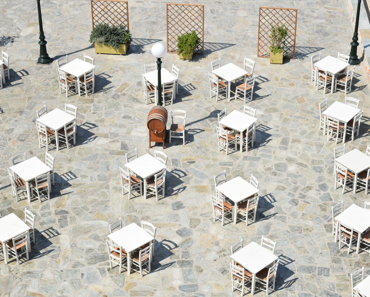 white and brown wooden chairs and tables