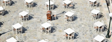 white and brown wooden chairs and tables