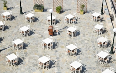 white and brown wooden chairs and tables