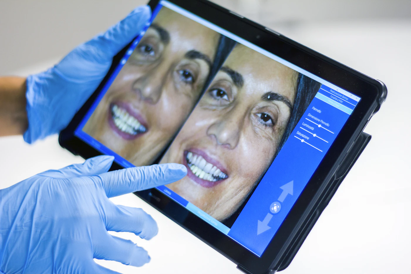 Dentist reviewing care with a patient at The House of Dental