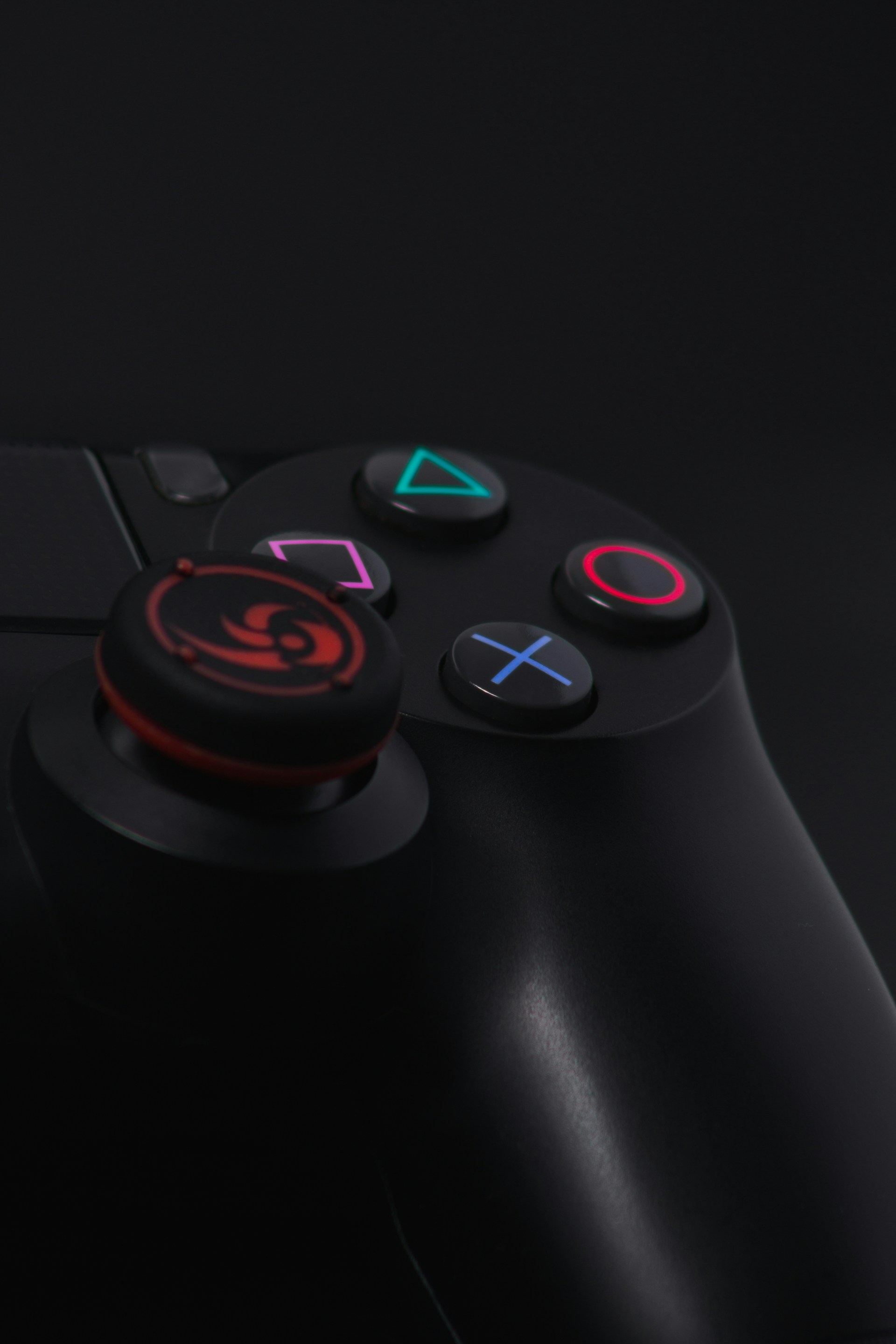 black game controller on black surface