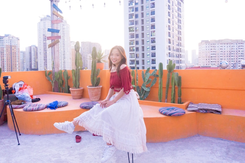 girl in white dress on blue mat