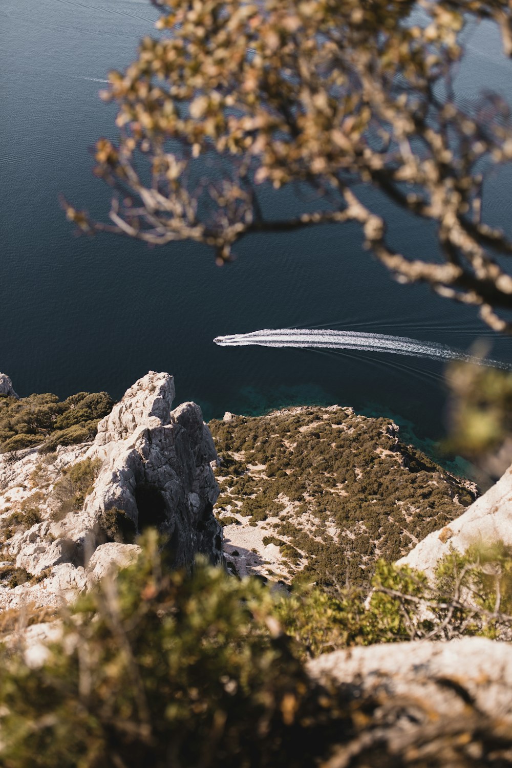 white rock formation near body of water during daytime