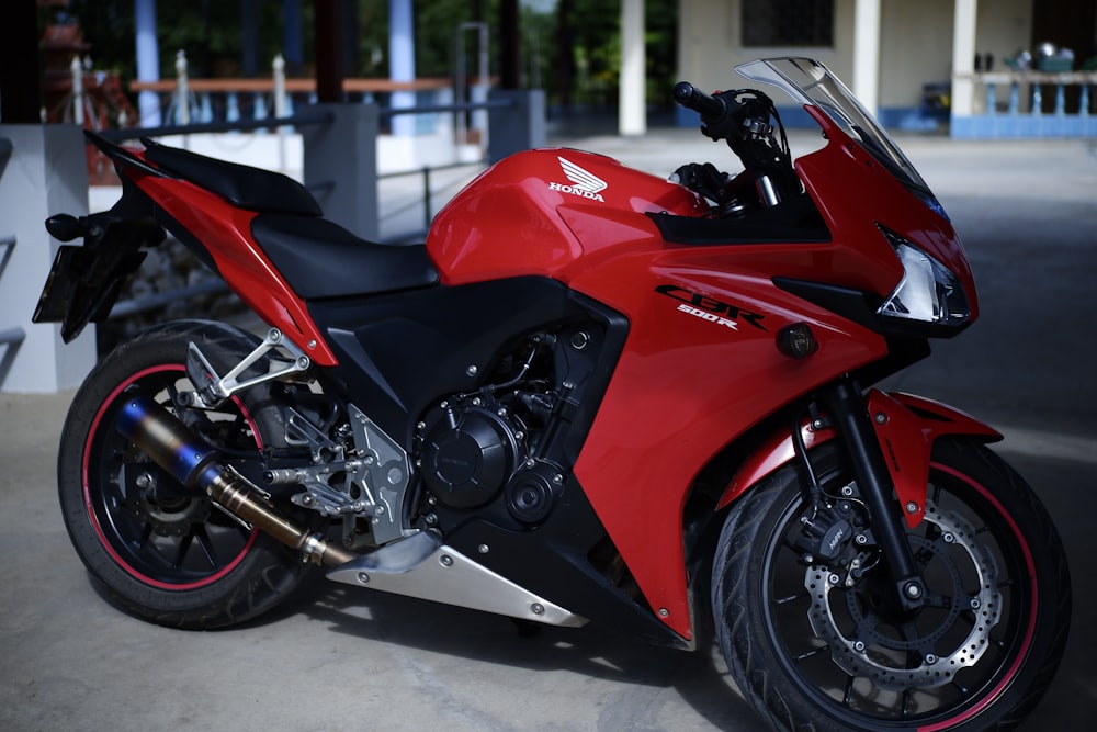 red and black sports bike