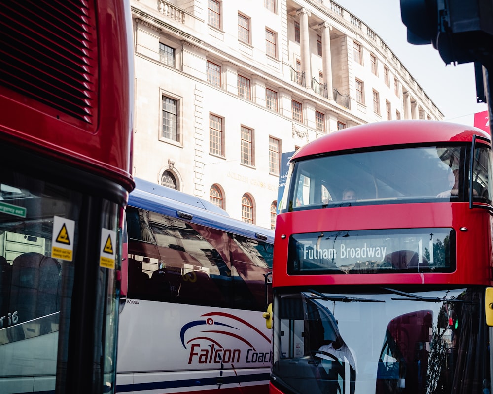 red and black bus on road during daytime