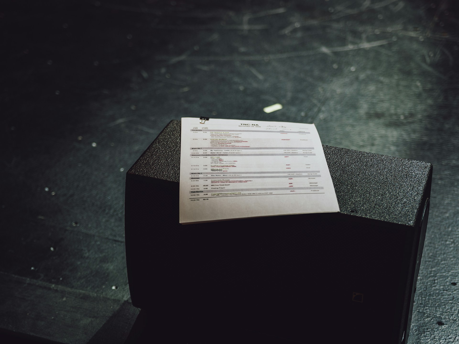 white paper document on black table