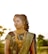 Happy Indian woman in traditional dress, standing outdoors with a serene background.