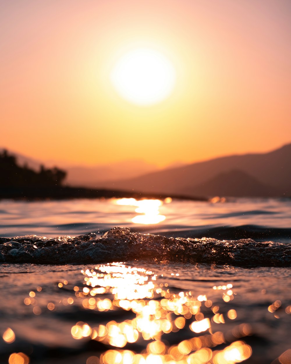 body of water during sunset