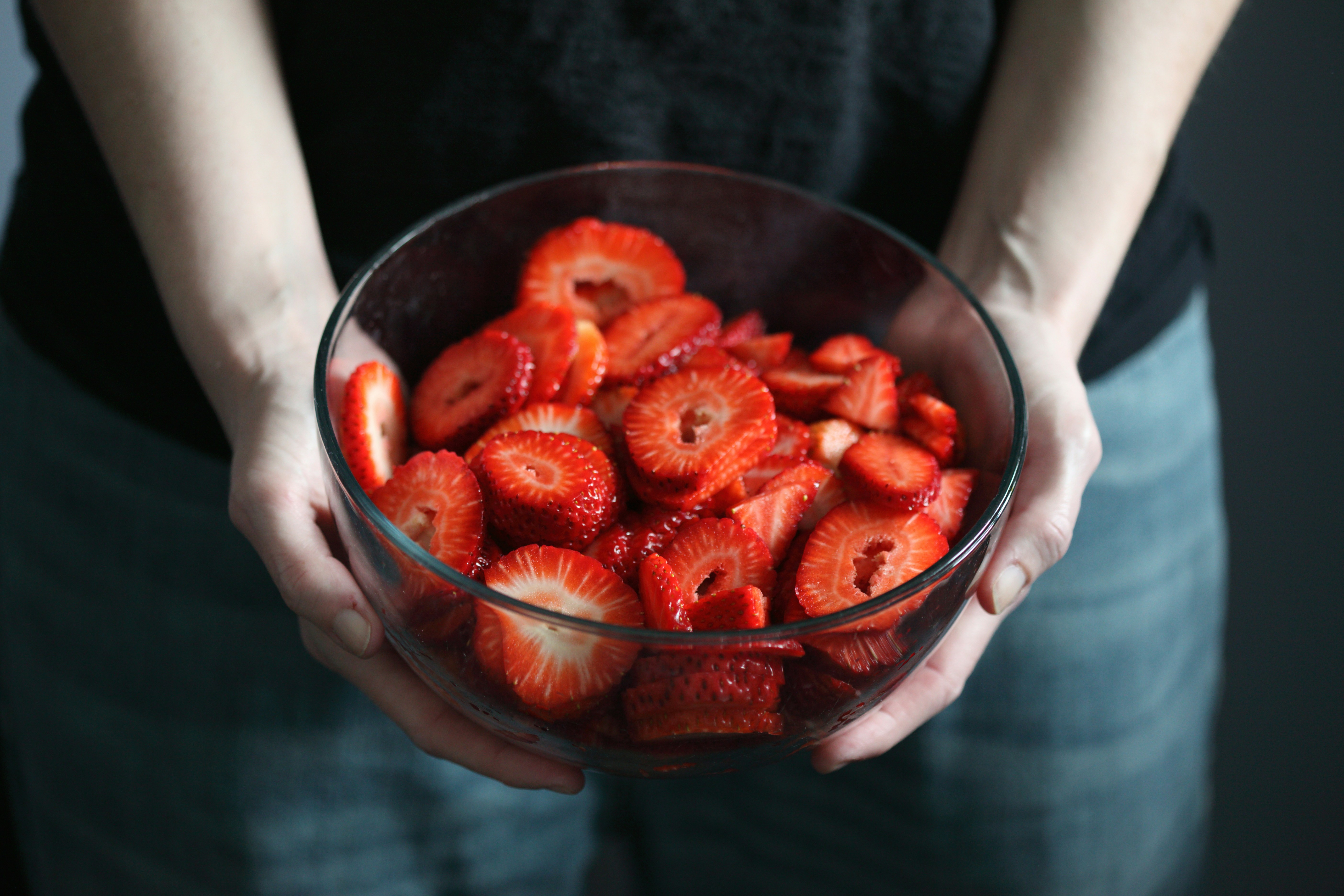 strawberries in clear glass bowl