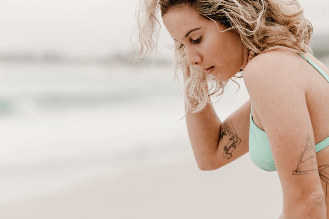 woman in teal tank top