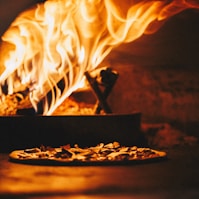 fire in brown wooden round tray