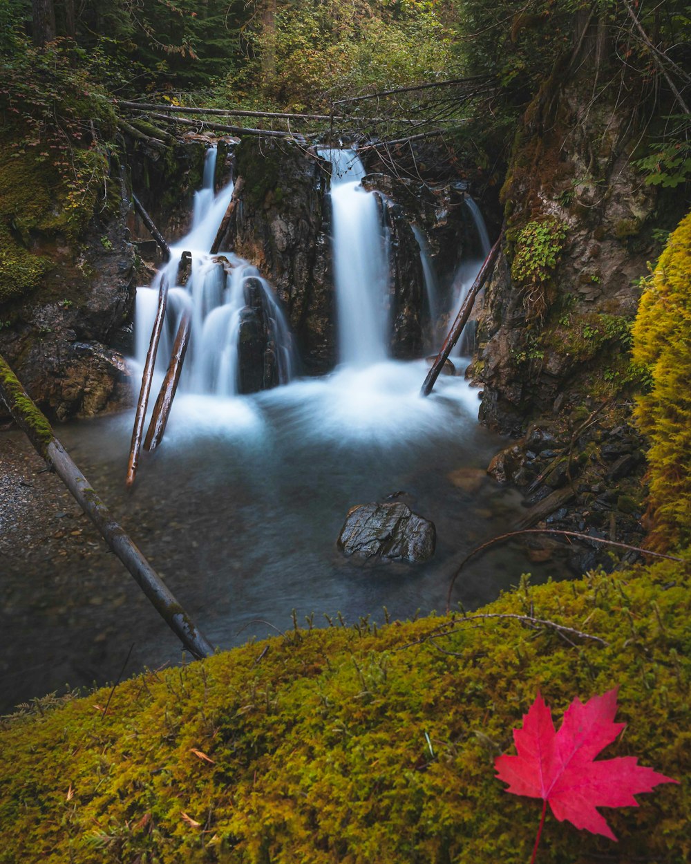 water falls on brown rock