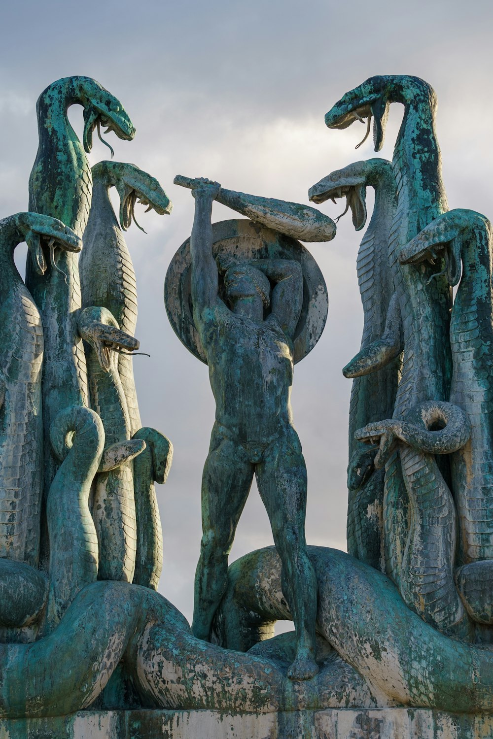 gray concrete statue under blue sky during daytime