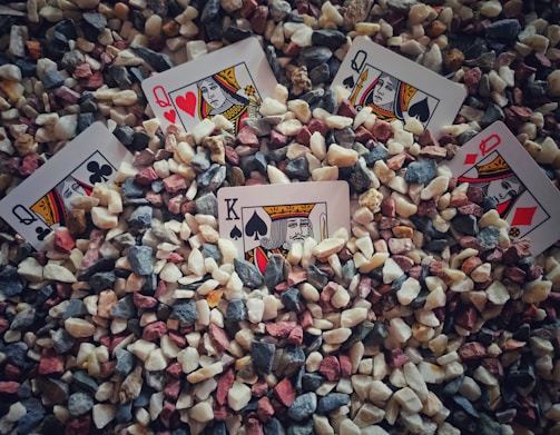 heart of ace playing card on gray and brown stones