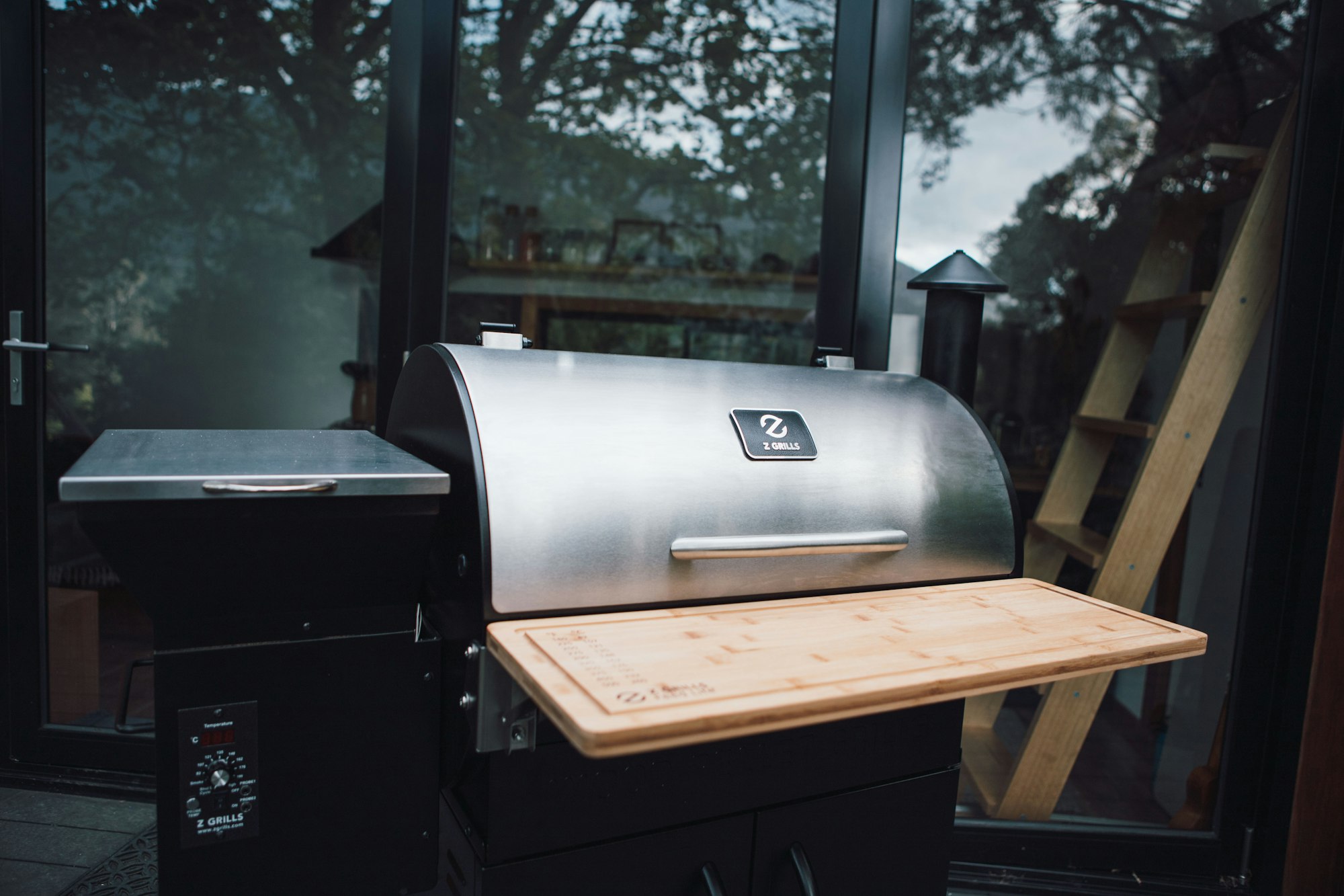 A smoker grill combo with a variety of fuel sources like wood pellets, charcoal, and gas