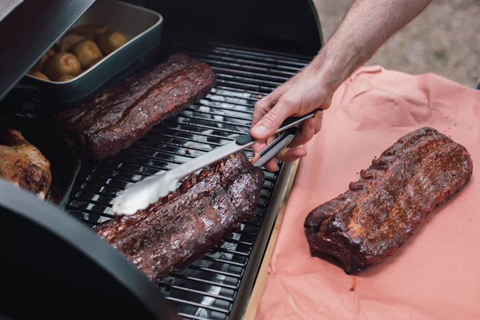 Brisket being sliced on a tray