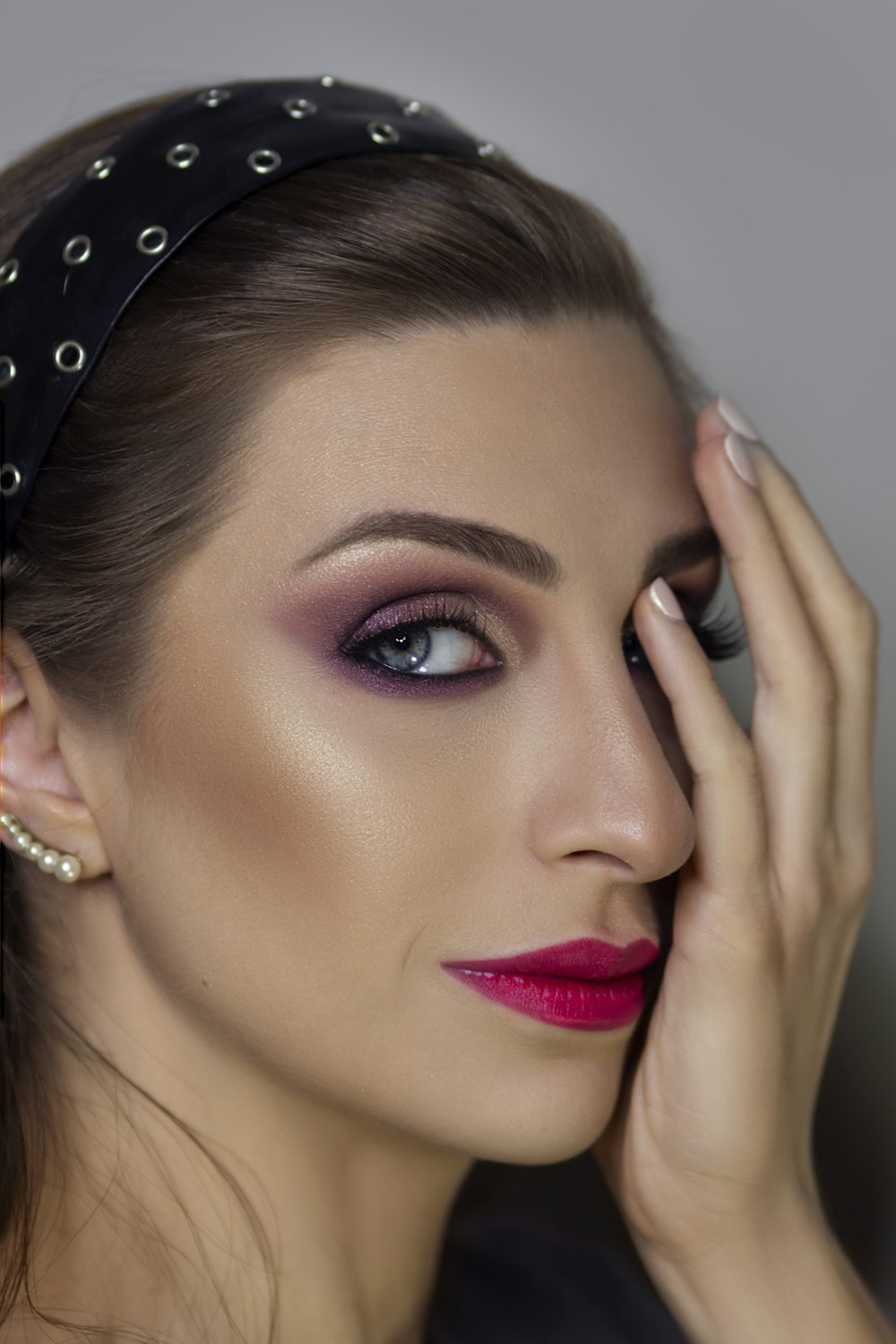 woman in silver and diamond studded earring