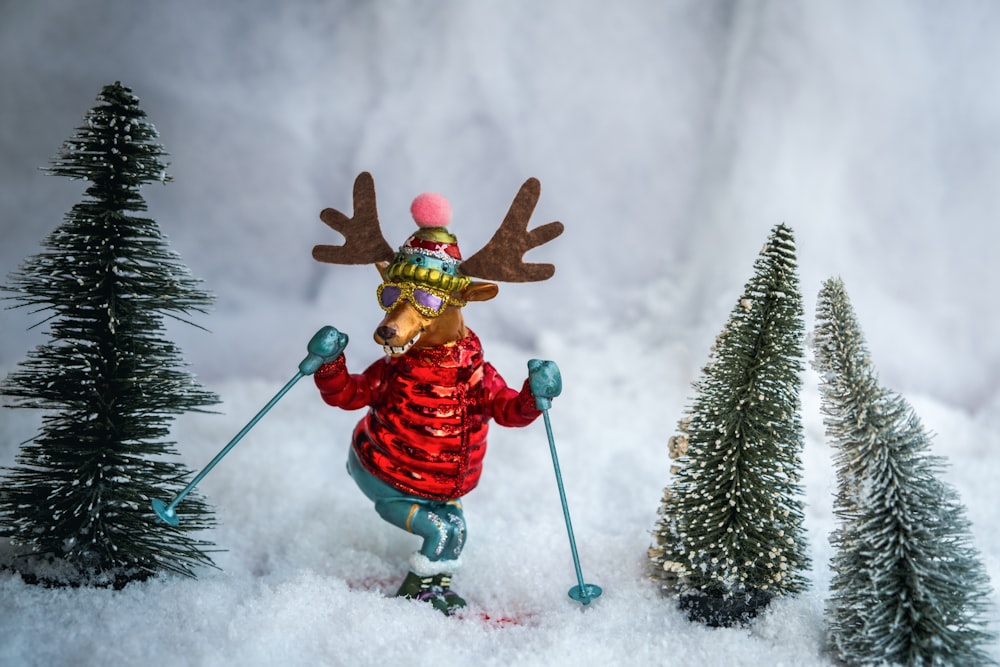 person in red jacket and pants riding on snow board