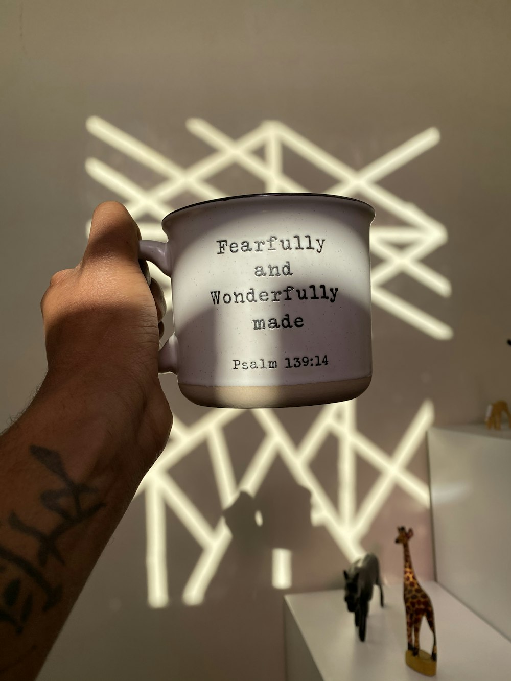 person holding white ceramic mug