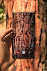 A user happily sharing photos on a smartphone using the Treegram app interface.