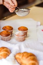 three cupcakes on white tissue paper