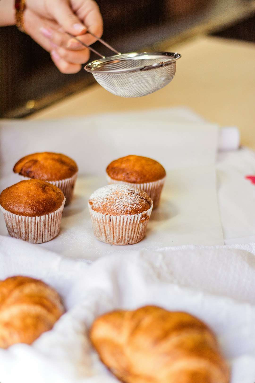 three cupcakes on white tissue paper