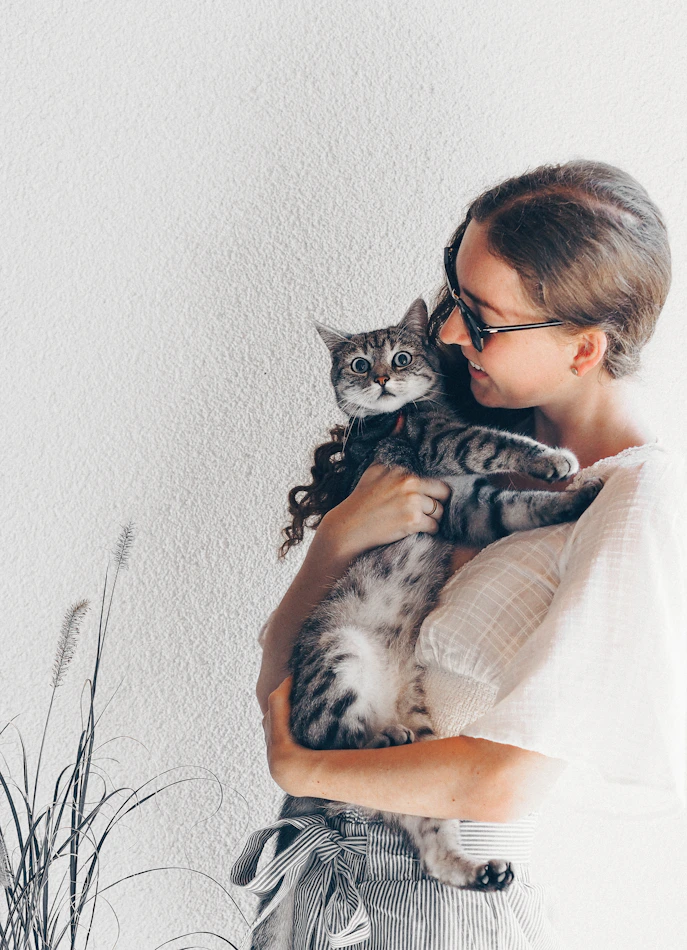 Woman with black and white cat