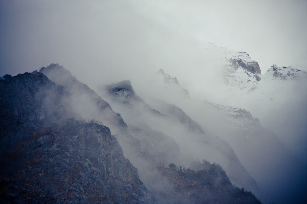 mountain covered with white clouds