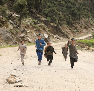 people walking on brown sand during daytime